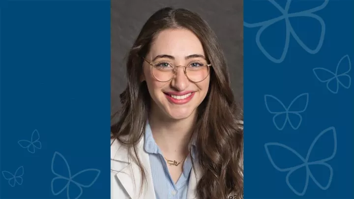 Professional headshot of Ruby Barq, MD against blue letterbox background