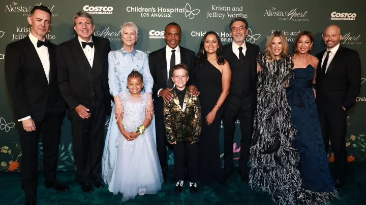 Colin Hanks, Paul Viviano, Jamie Lee Curtis, Ella Nelson, Sugar Ray Leonard, Pierce Kelly, Martha Saucedo, Chuck Lorre, Ellen K., Lisa Joyner and Jon Cryer smile as they pose for a photo at CHLA 2024 Gala