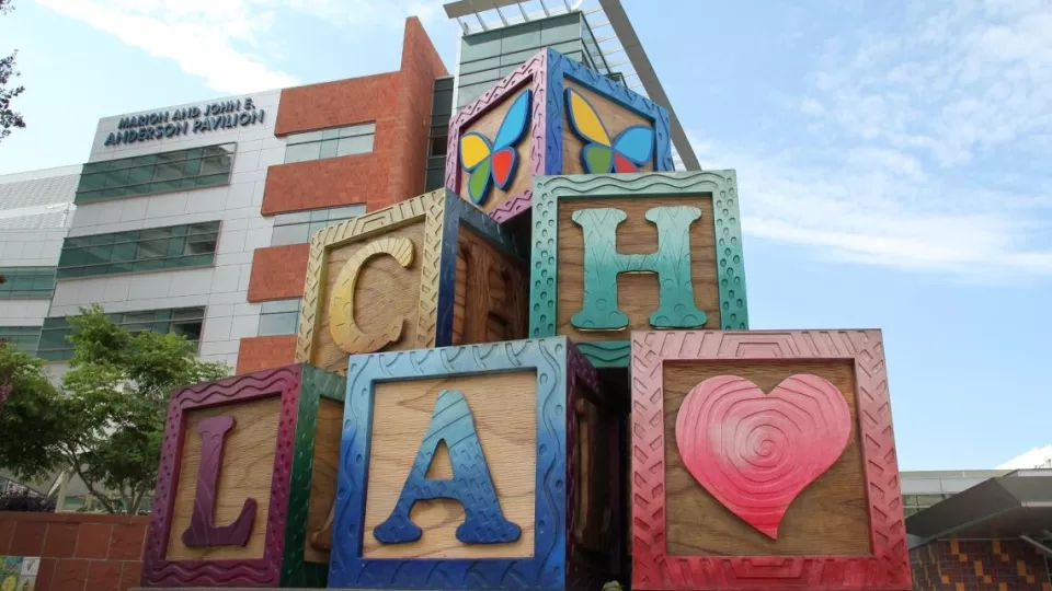 Oversized children's blocks that spell out CHLA outside the Anderson Pavilion building