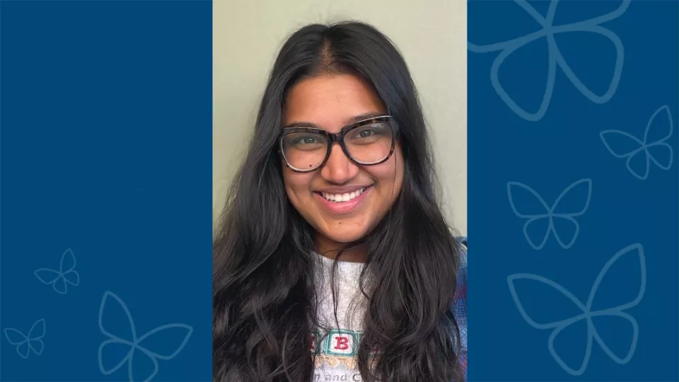 Professional headshot of Sara Trisha Yousuf, MPH, against a blue background with CHLA butterfly logo