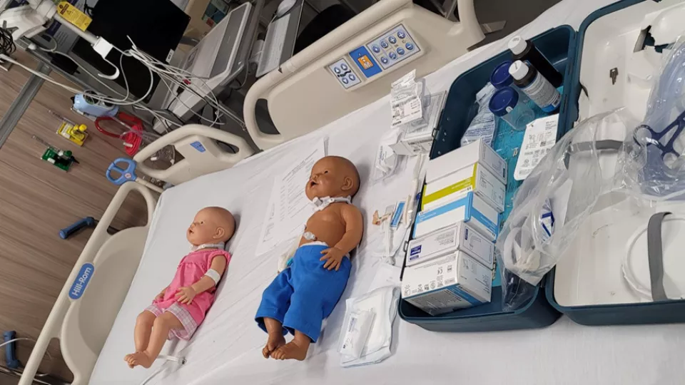 Pediatric mannequins lie in a hospital bed in the Las Madrinas Simulation Center