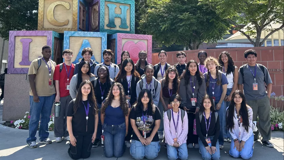 Group photo of around 25 teenagers arranged in three rows outside of Children's Hospital Los Angeles