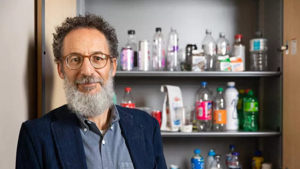 Michael I. Goran, PhD standing in front of shelves containing sugary beverages