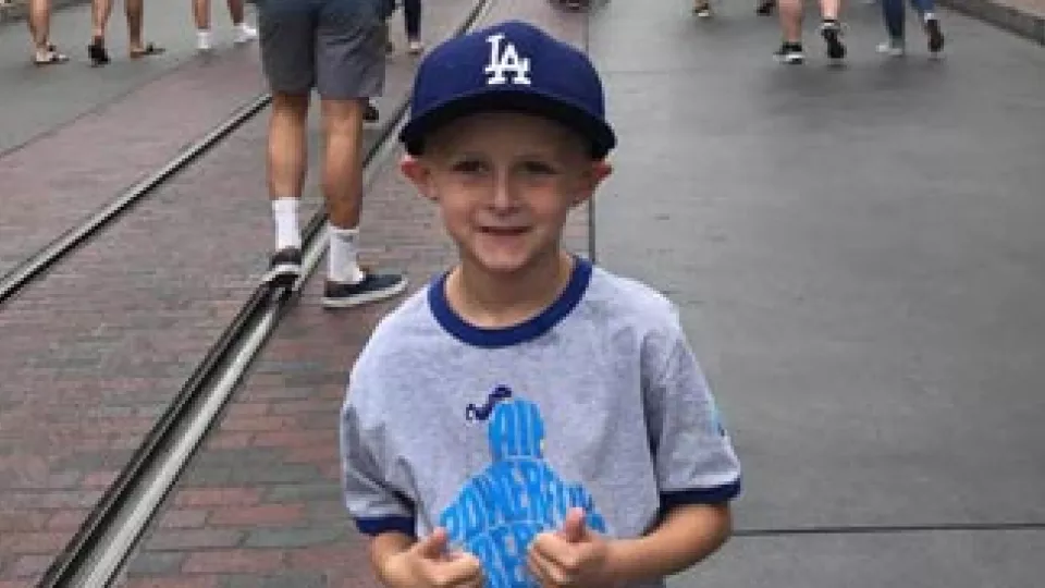 Josh at Disneyland giving two thumbs up