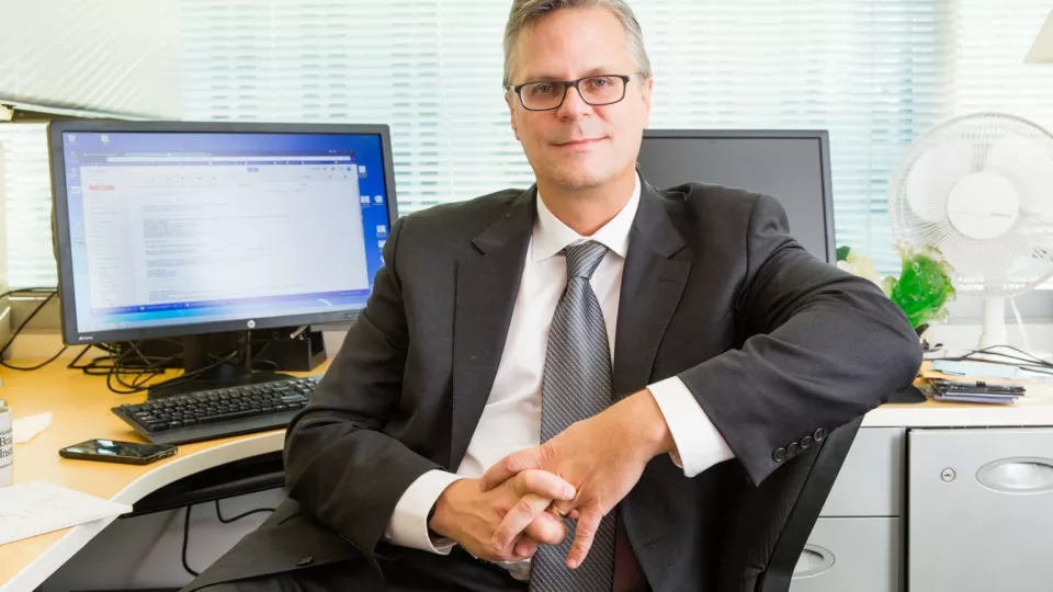 Professional portrait of Bradley Peterson, MD, seated in his office