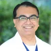 Professional headshot of Om Jha, MD