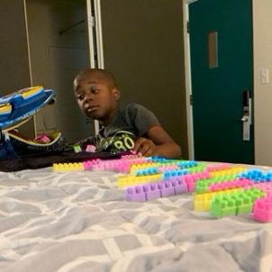 Evan constructing with his building blocks