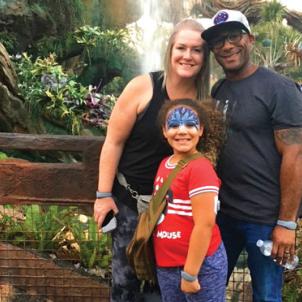 The Kenzie family in front of a waterfall