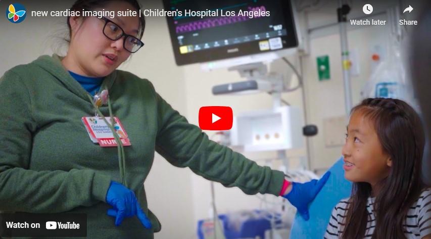 Screengrab of YouTube video player a female health care professional speaking to a young patient in a hospital imaging suite