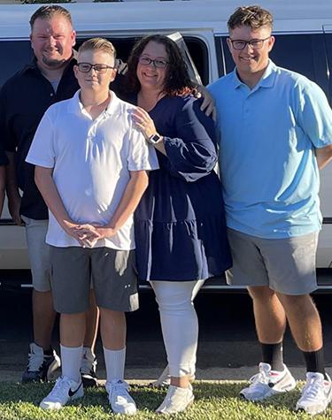 Jaykob poses with his mother, father and brother