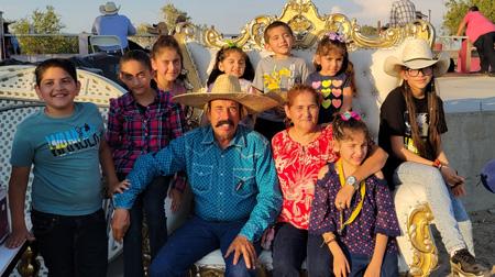 Natalia with her grandparents and seven siblings.